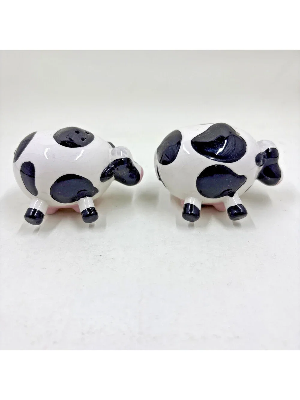 Farmhouse Style Mini Cow Salt and Pepper Shakers Resting on Utters 2.5
